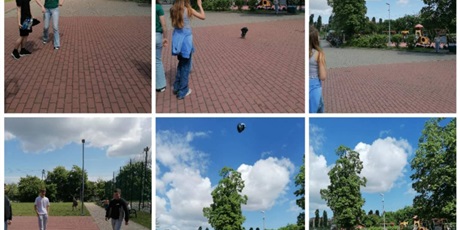 Powiększ grafikę: Uczniowie podczas sprawdzania efektów wykonywanego projektu na patio przed szkołą